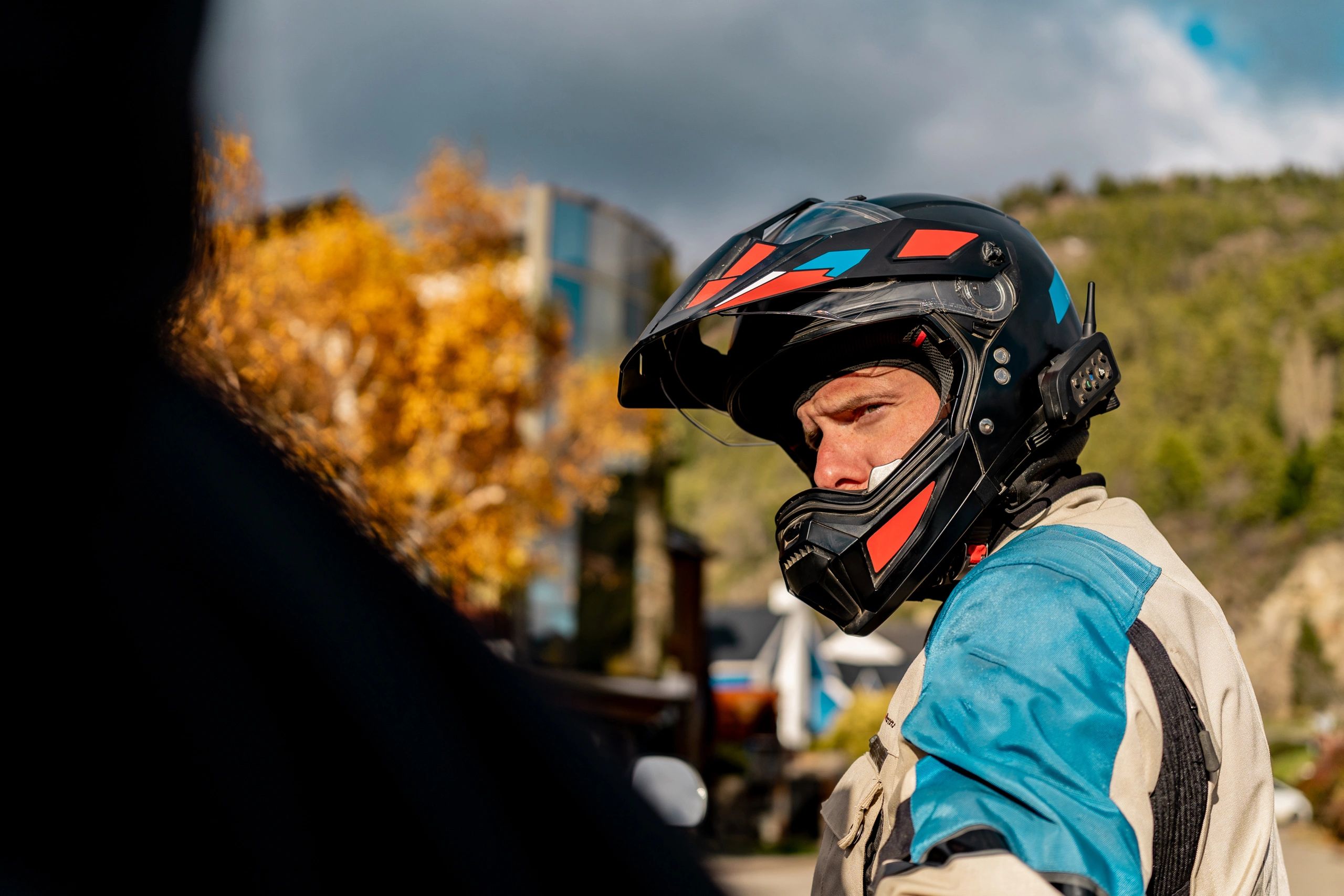 Motorcyclist wearing a full-face helmet on an open road
