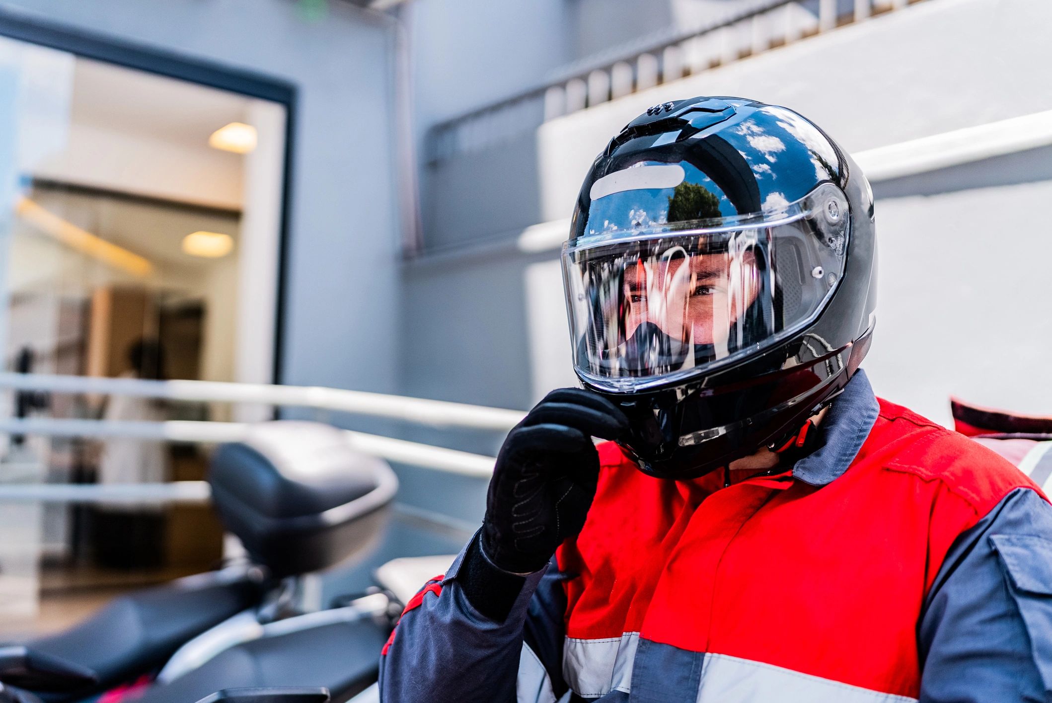 Motorcycle rider wearing a helmet outdoors